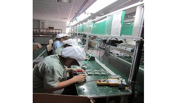 Workers on the POS machine production line