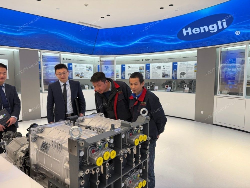Examining a complex hydraulic manifold block in the showroom
